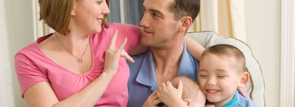 Family members using sign language to talk to each other.