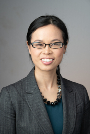 Headshot of Anita Yip smiling and wearing professional attire.