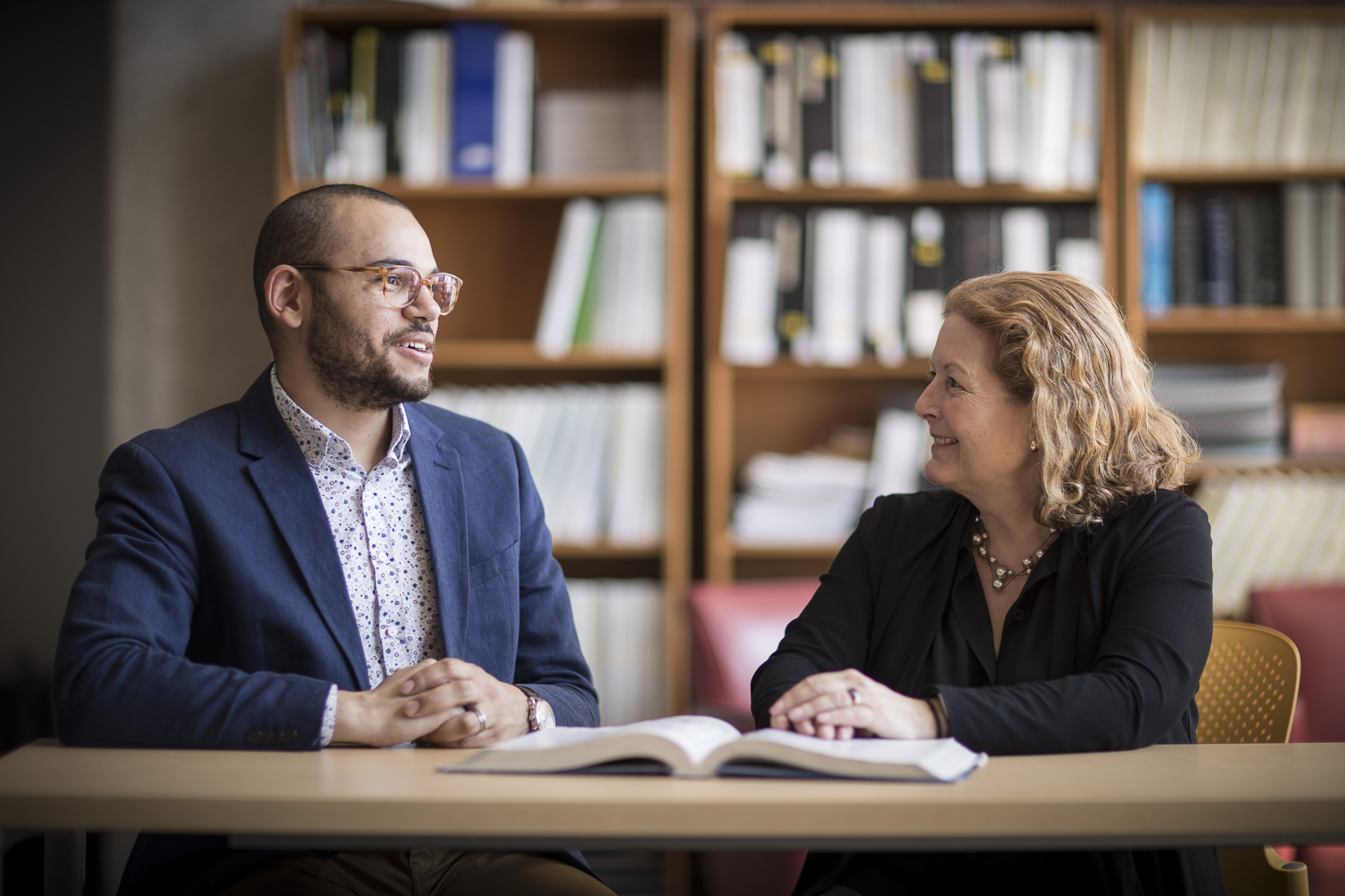 MBA Program Director Carole Carlson, right, speaking with a student