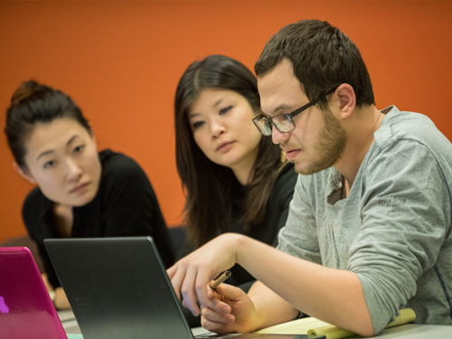 Students viewing computer in class