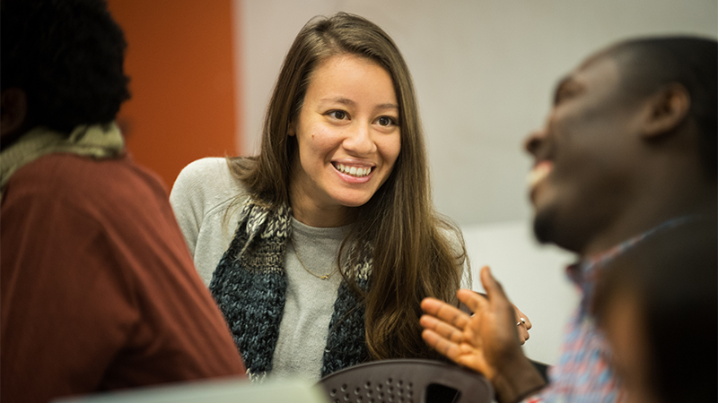 students talking and smiling in class