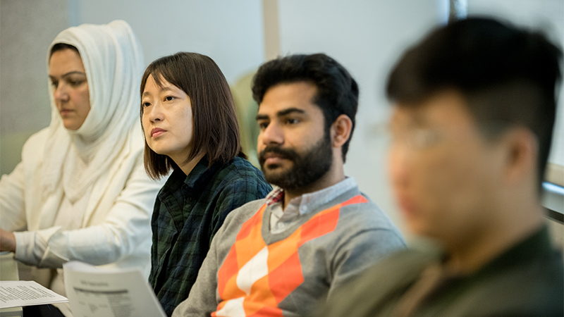 four students paying attention