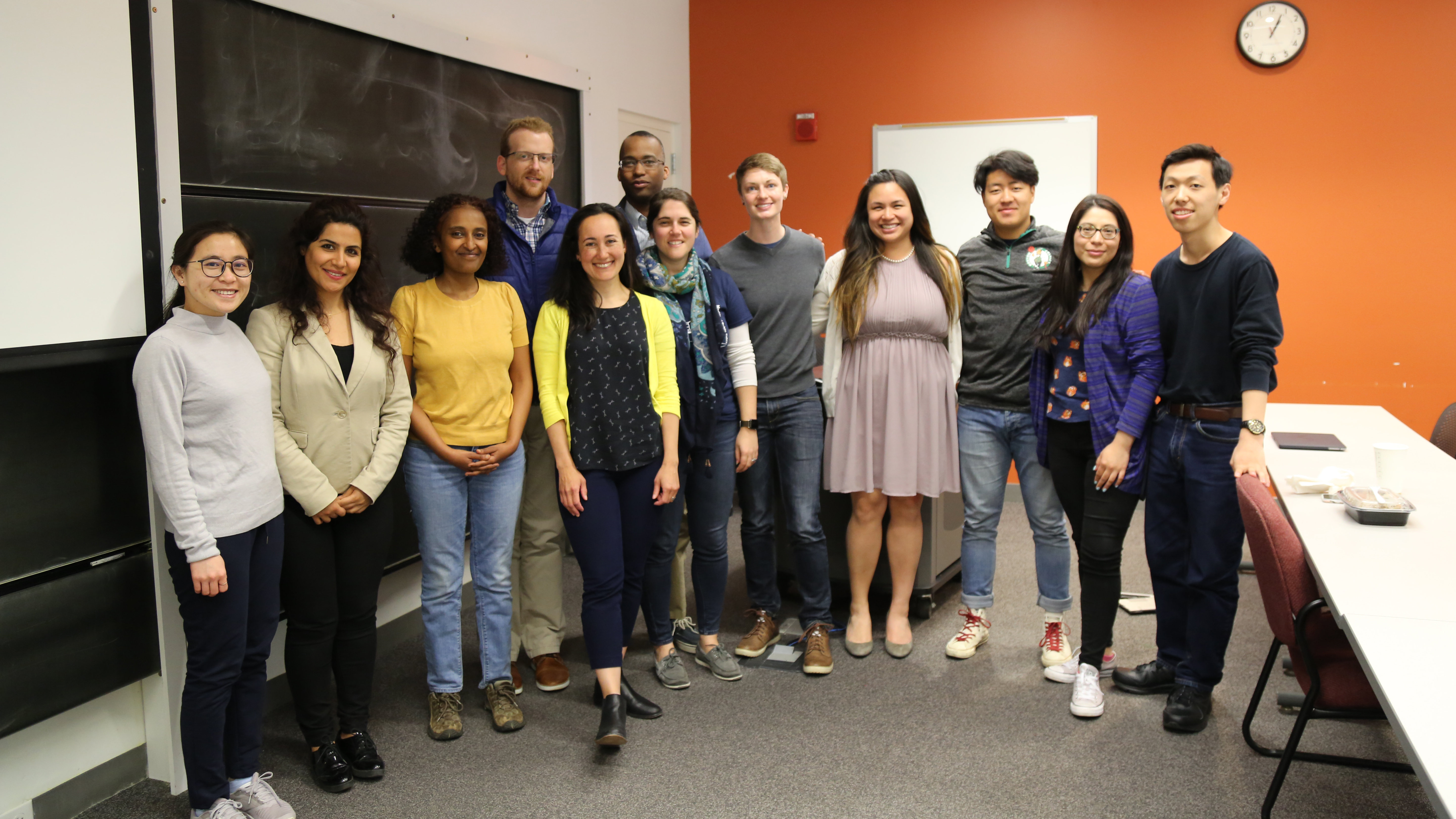 Sarah Zoen, MA SID'06, (center, yellow cardigan) with a group of students during a Lunch and Learn session hosted by the Heller Career Development Center