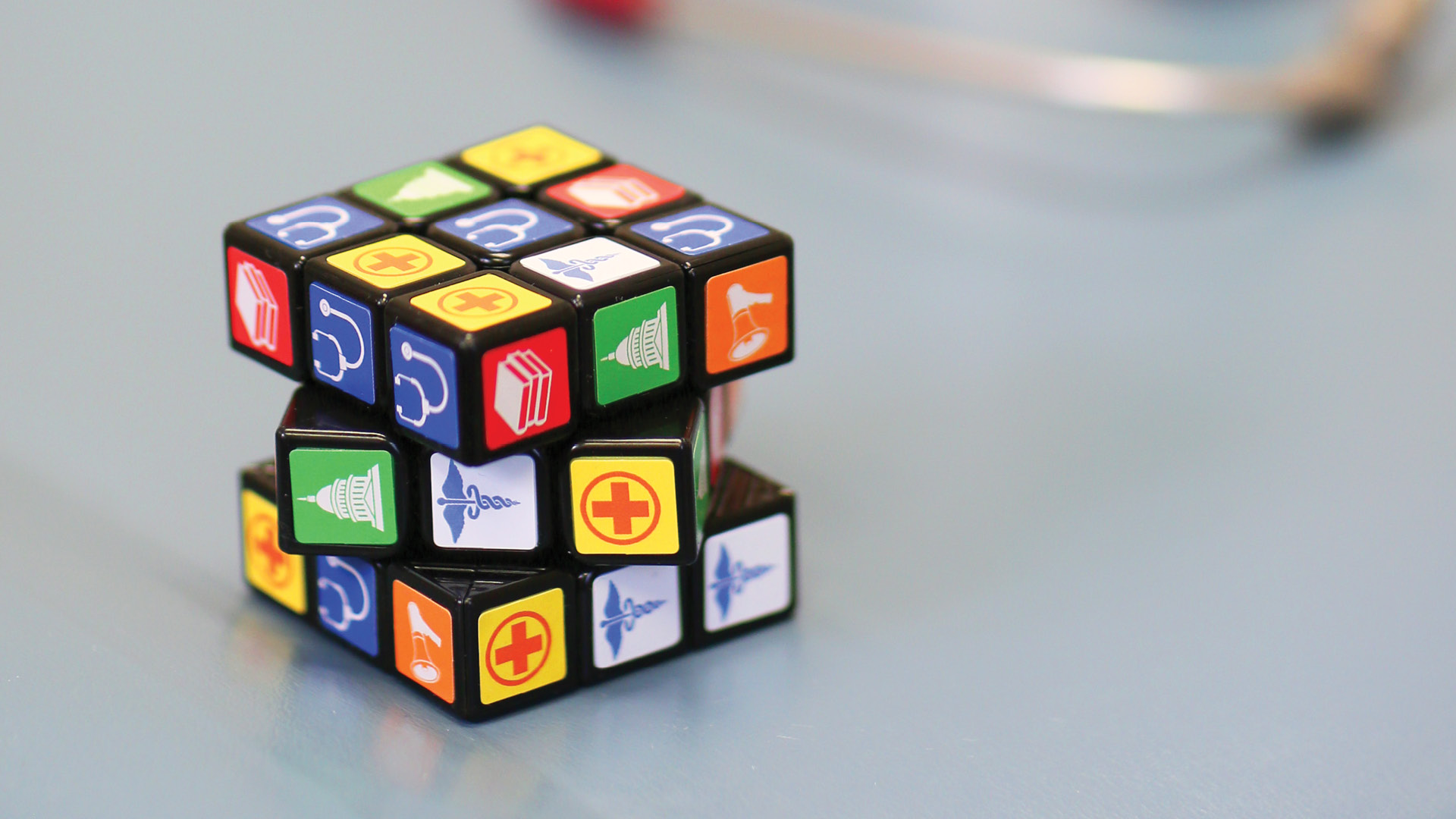 Rubik's cube with health care themed icons